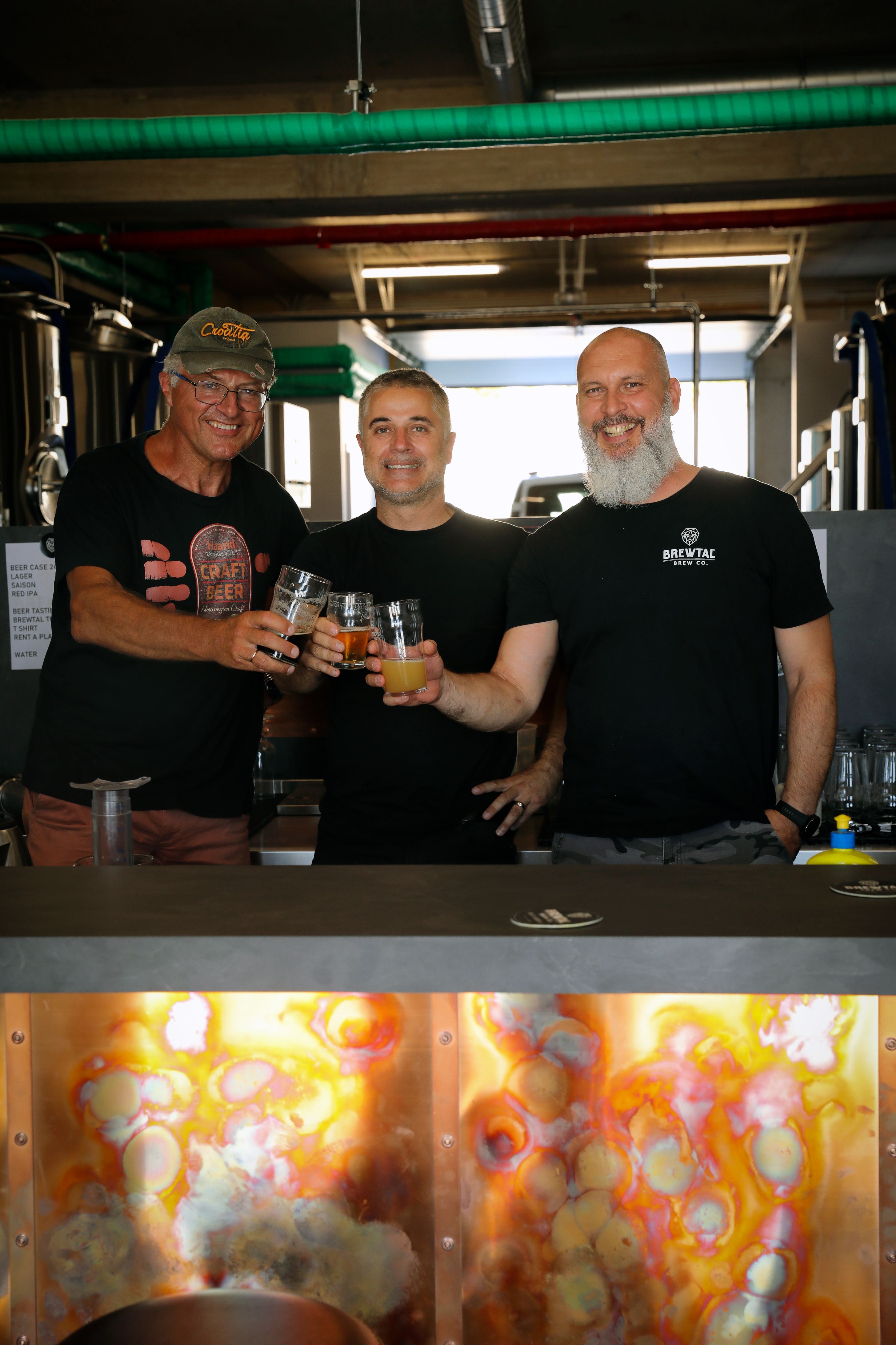 Brewtal Brew Co. brewers toasting craft beer flights at their Croatian brewery
