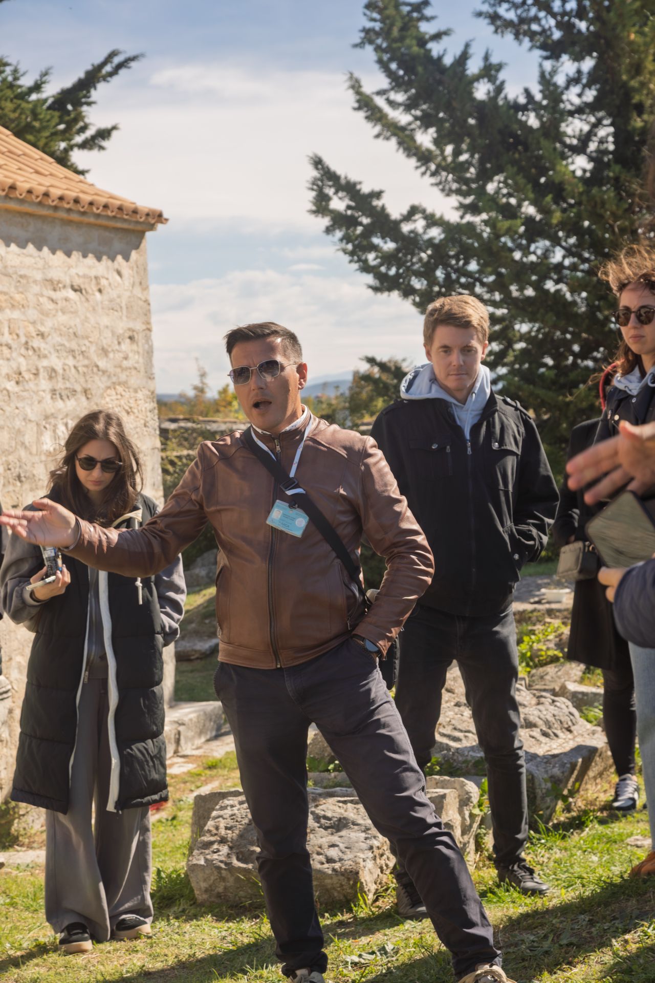 A licensed Croatian guide leading an Authland group through a heritage site