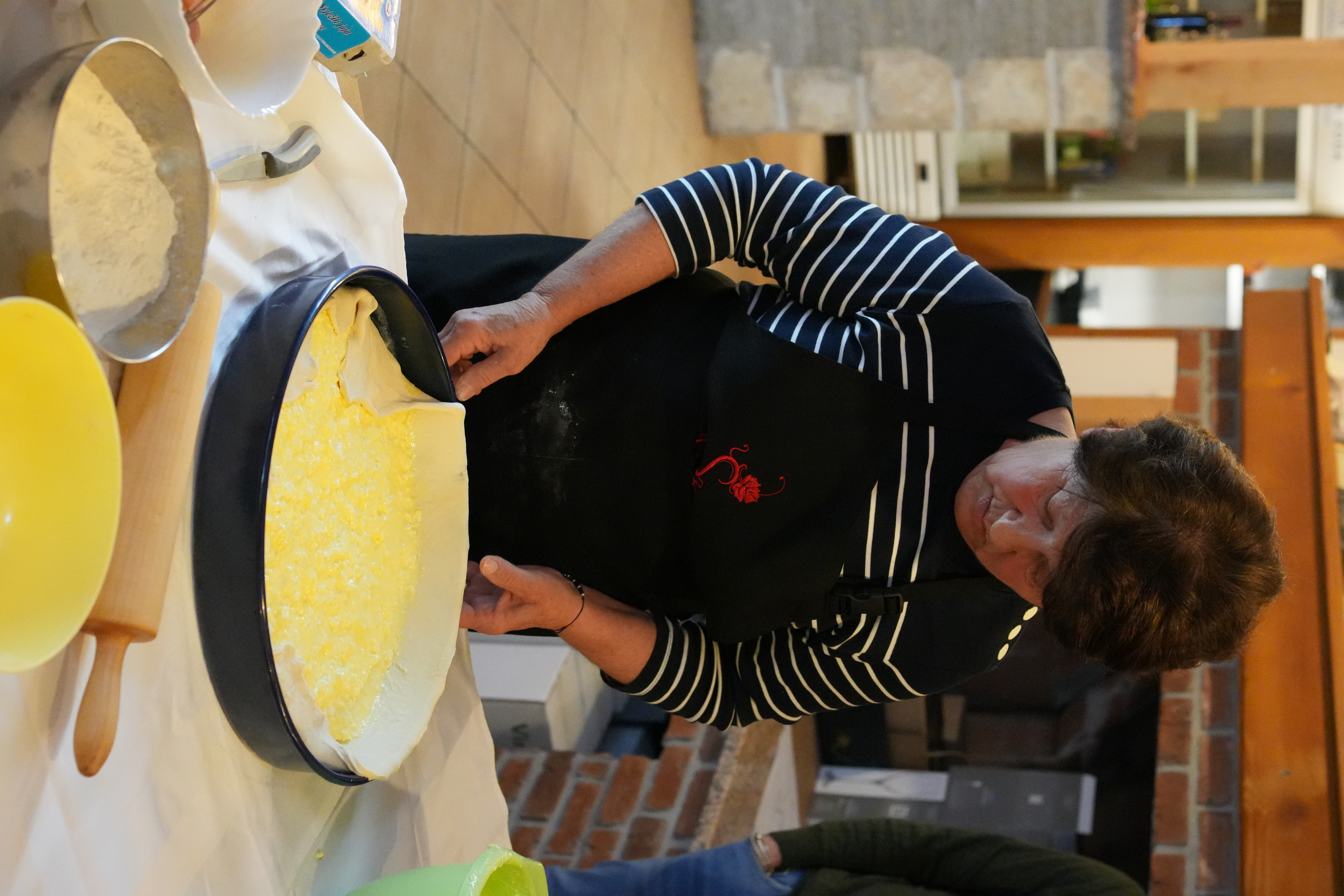 Mixing flour and eggs at a Croatian agritourism hands-on cooking workshop