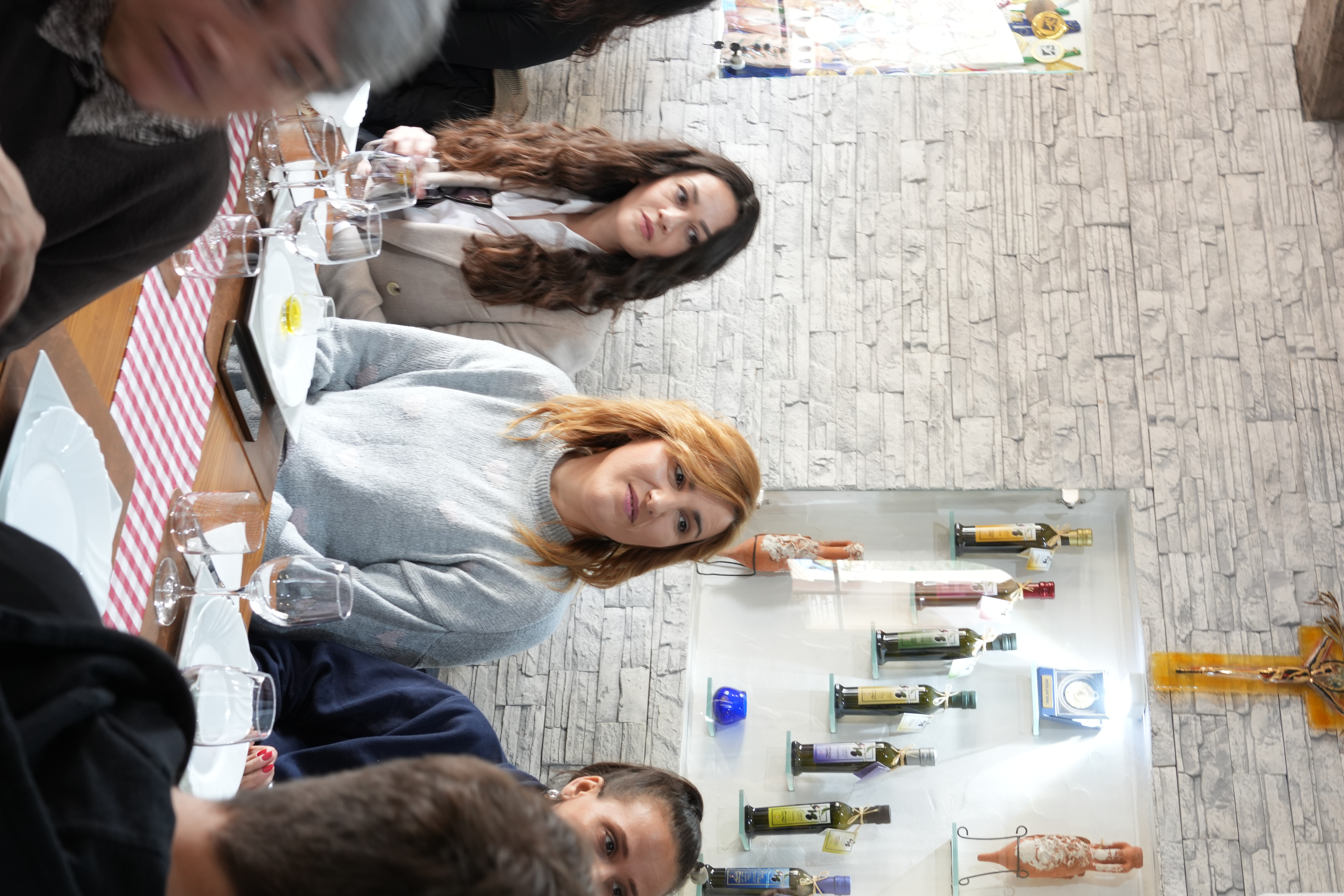 A Croatian winemaker speaking in front of a chalkboard wine flavour wheel