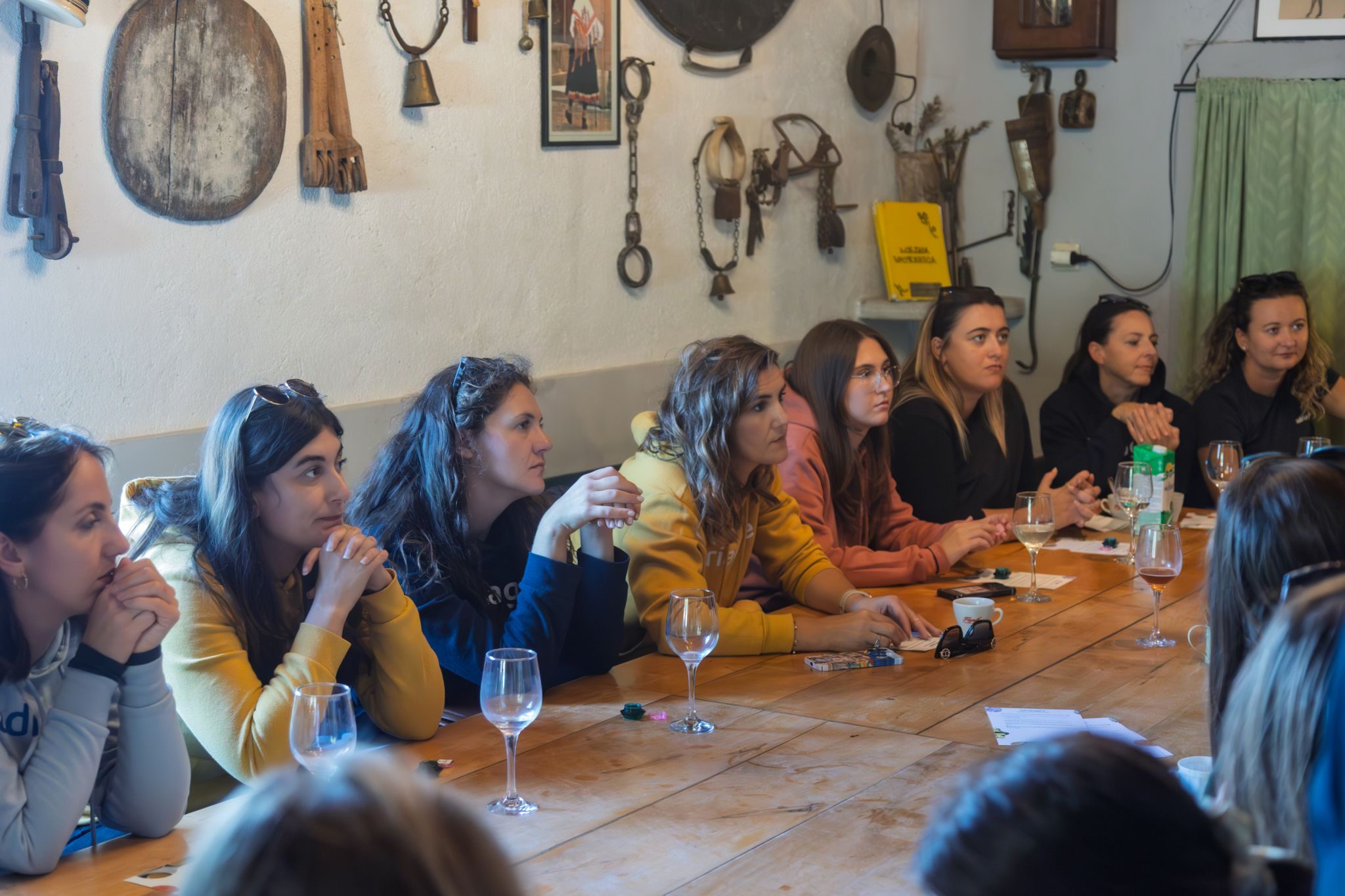 Adriagate guests gathered around a long konoba table for a curator-led homemade cosmetics workshop and presentation