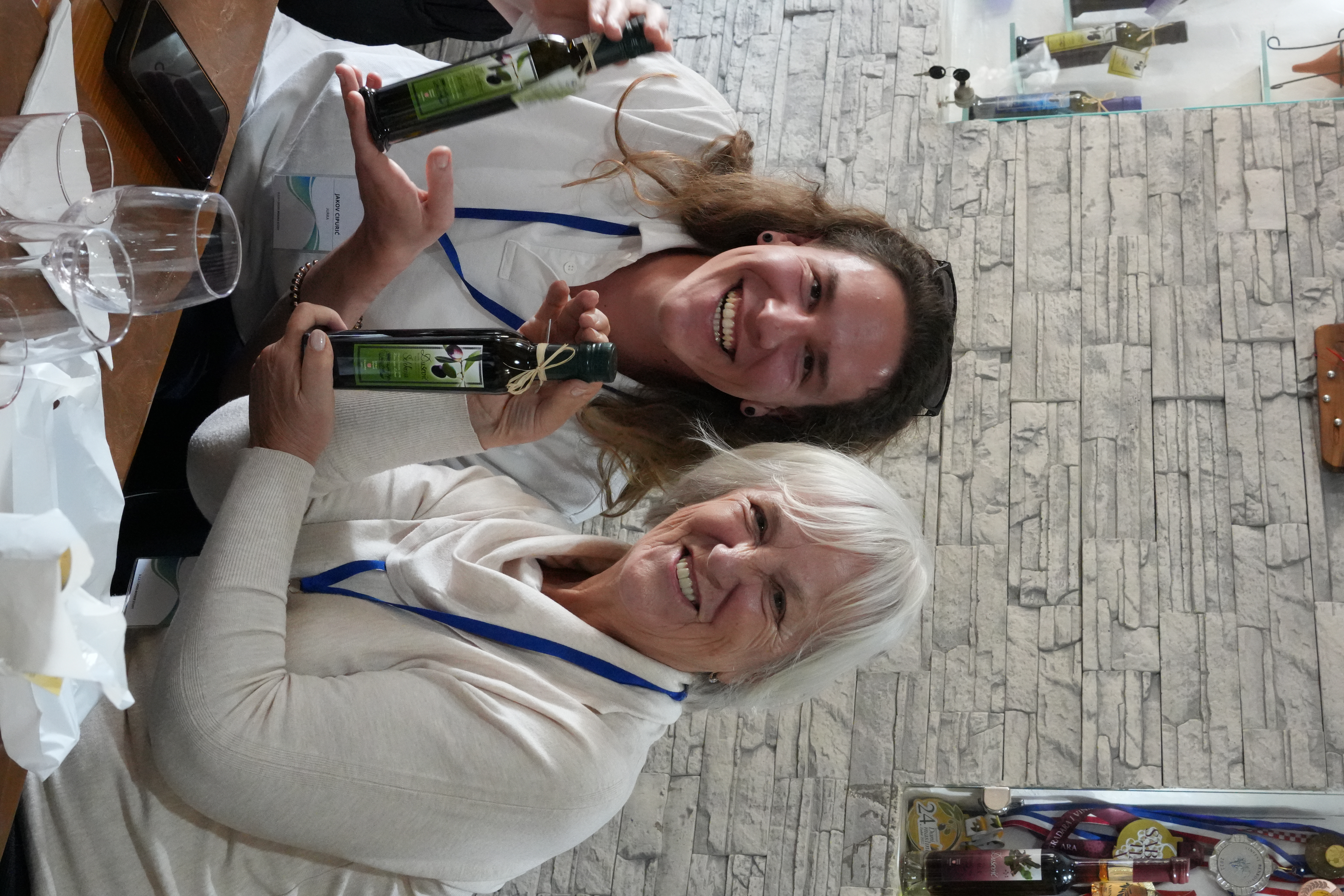 Croatian olive-oil producer sharing his award-winning extra virgin olive oil with an Authland tailored group guest